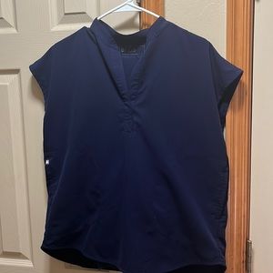 Navy blue figs oversize scrub top size small. Small bleaching;see pictures.
